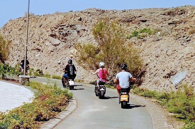 Maspalomas - Meloneras : e-Scooter 2 seat Sunset Guided Tour - La Charca lagoon stop: birds, fish, and a breather